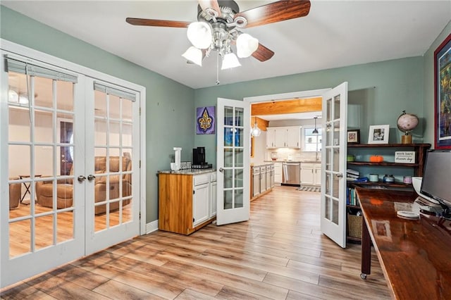 kitchen featuring white cabinets, french doors, and light hardwood / wood-style flooring