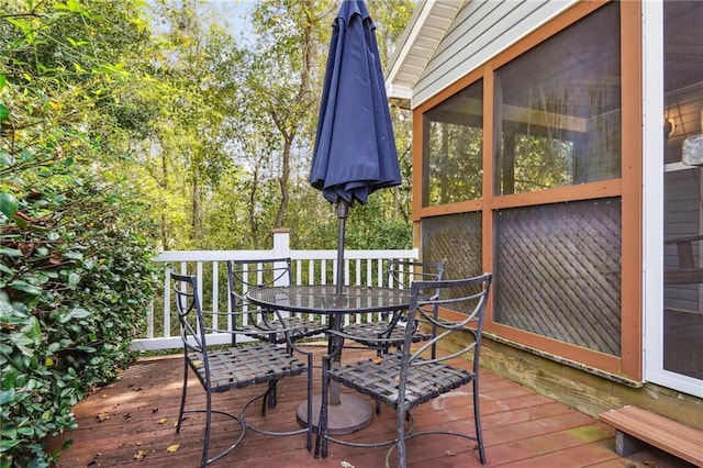 wooden terrace featuring a sunroom