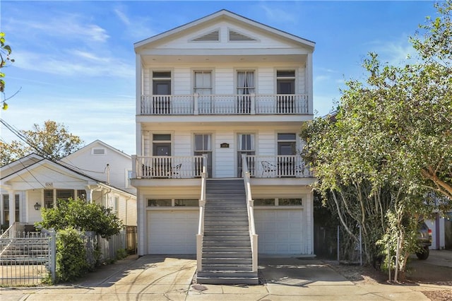 view of front of property with a garage and a balcony