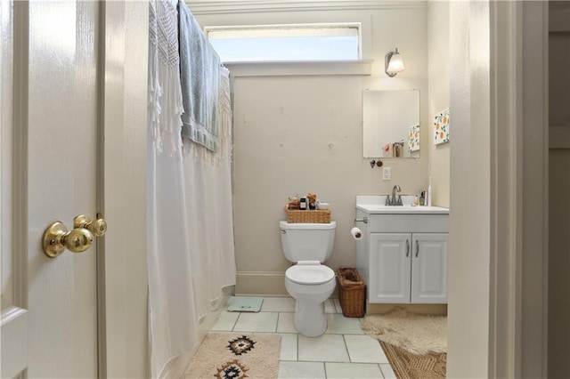 bathroom featuring toilet, vanity, and tile patterned floors