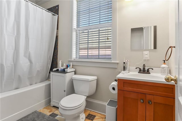 full bathroom featuring vanity, tile patterned floors, toilet, and shower / tub combo with curtain