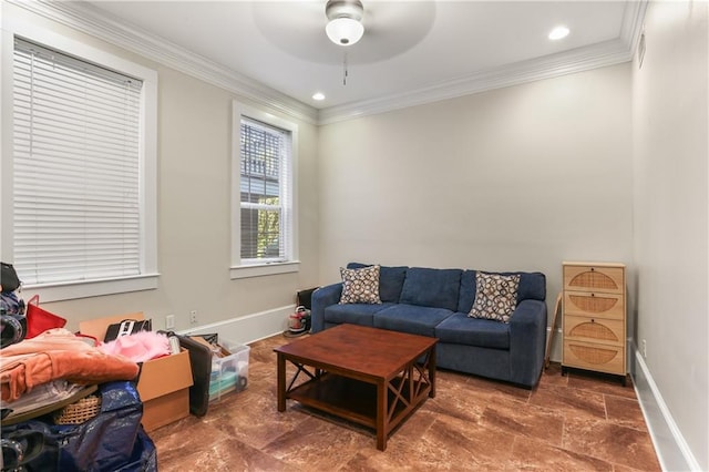 living area with ceiling fan and crown molding