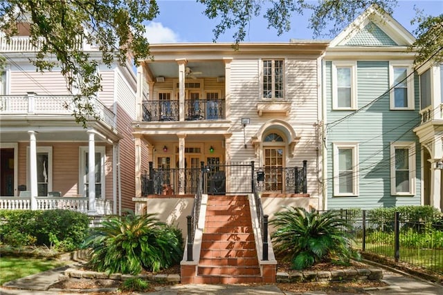 view of front of home with covered porch and a balcony