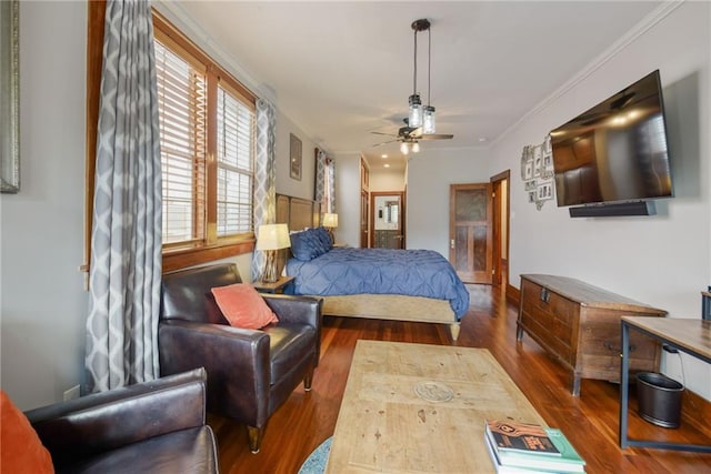 bedroom with ceiling fan, dark hardwood / wood-style flooring, and ornamental molding