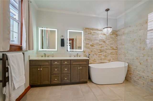 bathroom featuring ornamental molding, tile patterned flooring, vanity, and a washtub