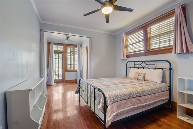 bedroom featuring ornamental molding, hardwood / wood-style floors, and ceiling fan