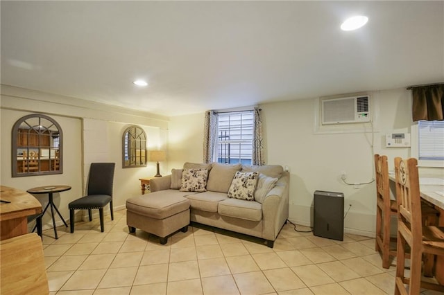 living room featuring a wall mounted AC and light tile patterned floors