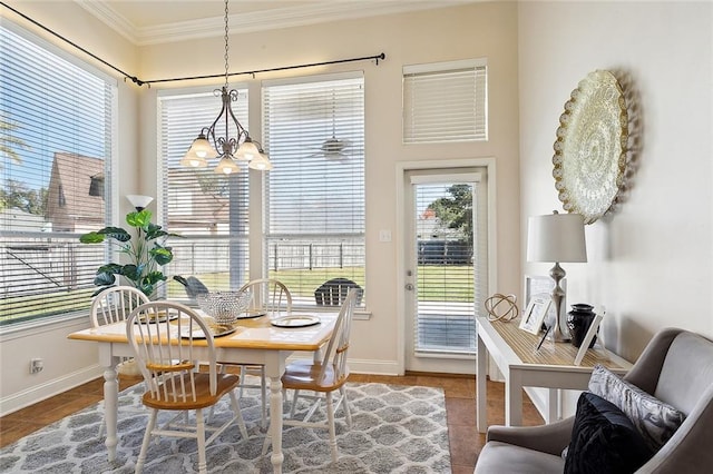 sunroom / solarium featuring a notable chandelier