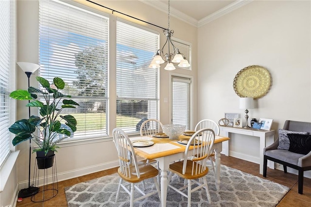 dining area featuring dark tile patterned flooring, an inviting chandelier, and crown molding