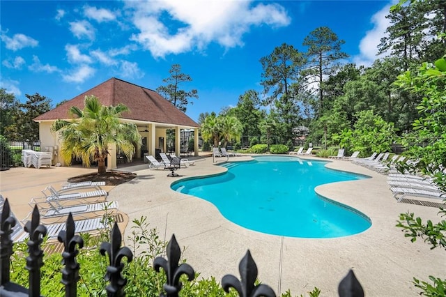 view of swimming pool with a patio