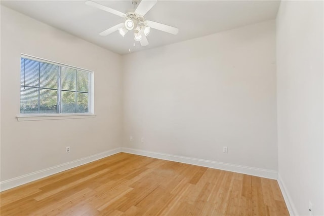 spare room with wood-type flooring and ceiling fan