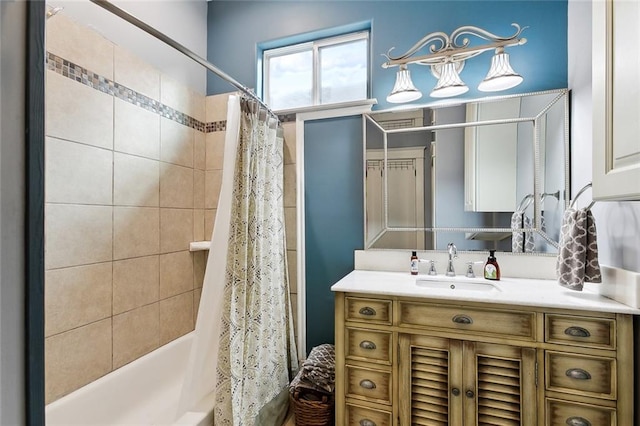 bathroom featuring shower / bath combo and vanity