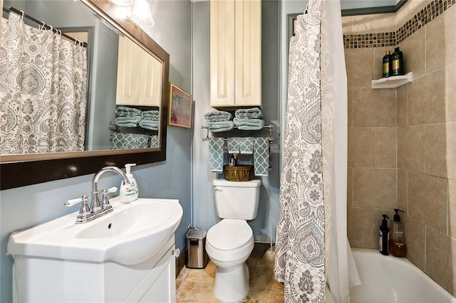 full bathroom featuring toilet, shower / tub combo, and vanity