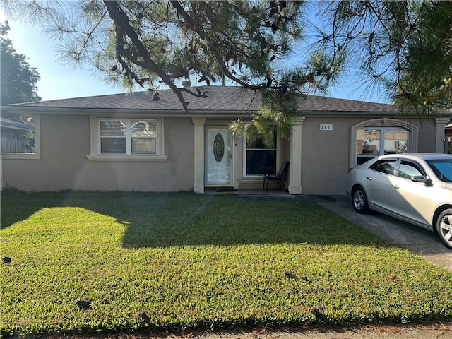 single story home with a front yard