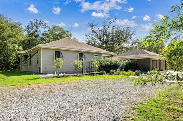 view of home's exterior featuring a yard and a carport