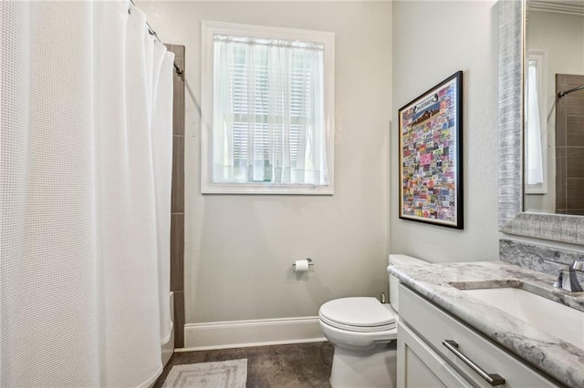 bathroom with toilet and vanity