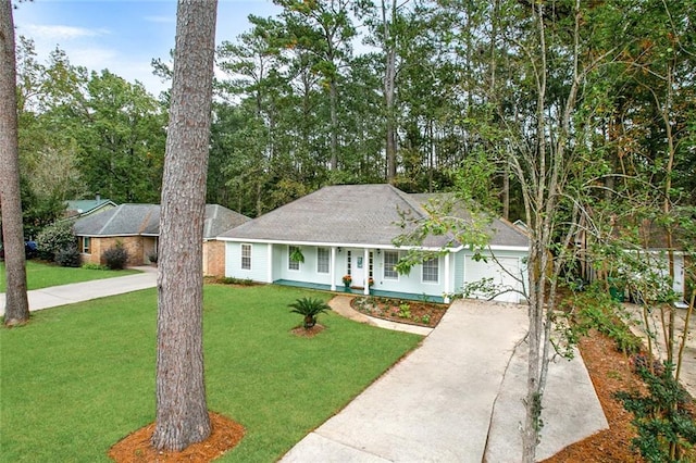 single story home featuring a front lawn and a garage