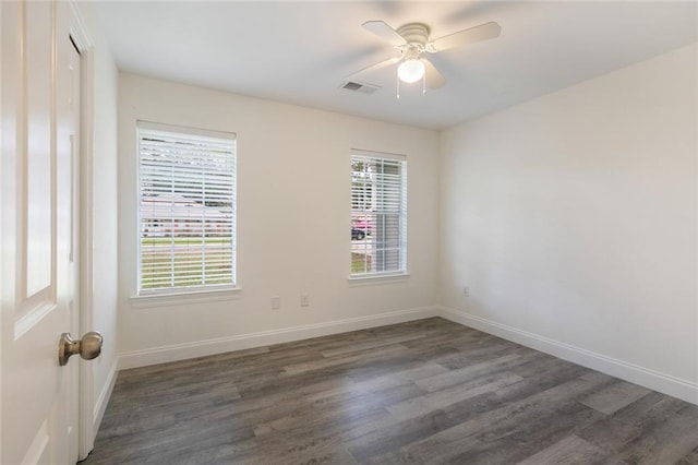 unfurnished room with dark wood-type flooring and ceiling fan