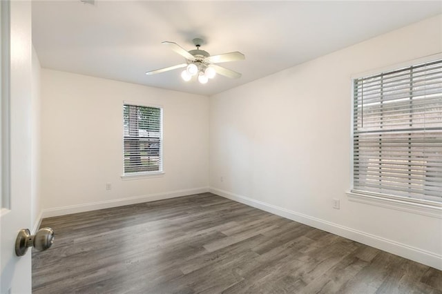 unfurnished room with ceiling fan and dark hardwood / wood-style flooring