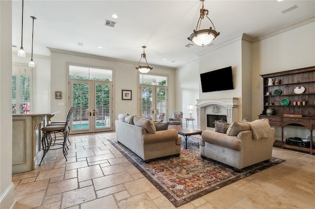 living room with crown molding and french doors