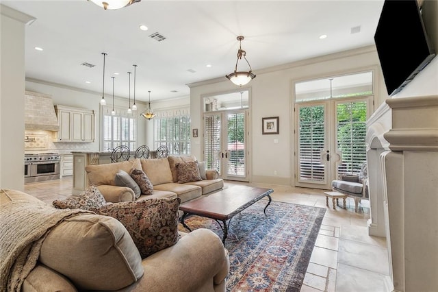 living room featuring french doors and ornamental molding