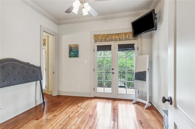 doorway to outside featuring french doors, ceiling fan, ornamental molding, and wood-type flooring