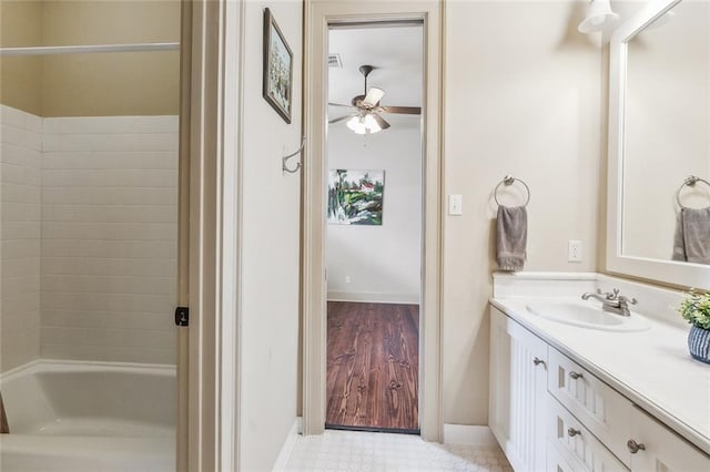 bathroom featuring hardwood / wood-style flooring, vanity, and ceiling fan