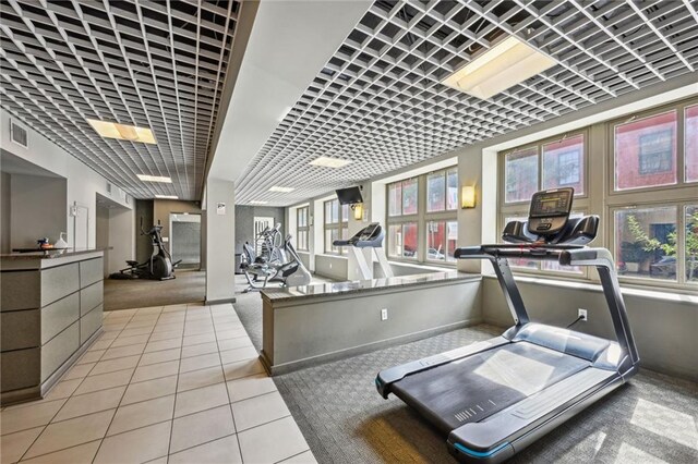 333 Julia St Unit 516, New Orleans, LA 70130 - gym featuring carpet floors and tile patterned floors