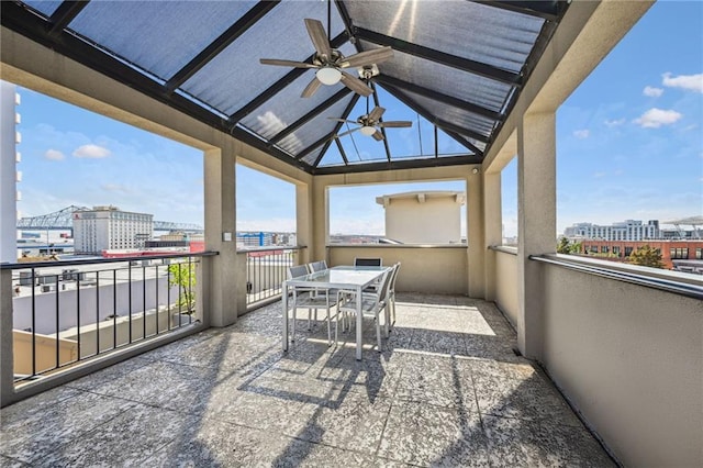 view of patio with a balcony and ceiling fan