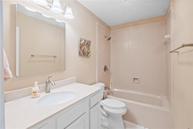 full bathroom with vanity, toilet, and tiled shower / bath