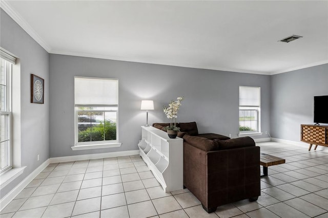 living room with light tile patterned floors and ornamental molding