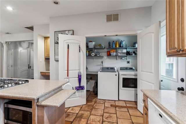 kitchen with separate washer and dryer and stainless steel appliances