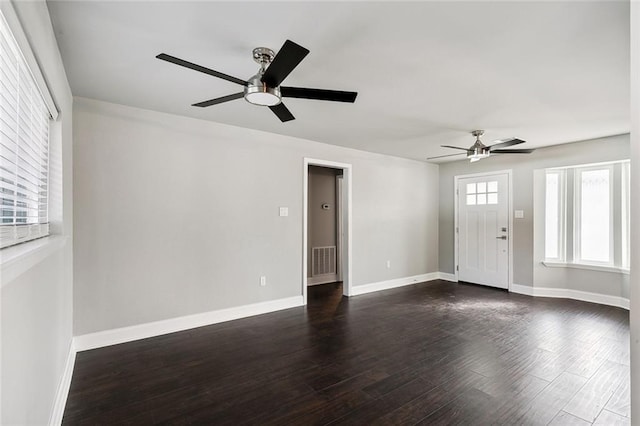 interior space featuring ceiling fan and dark hardwood / wood-style floors