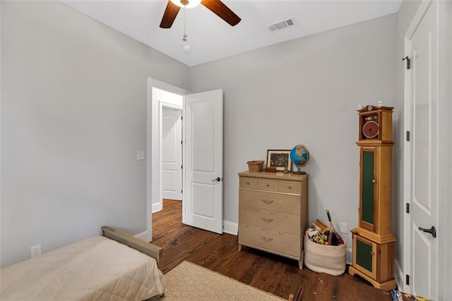 bedroom with ceiling fan and dark hardwood / wood-style flooring