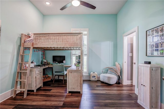 bedroom featuring ceiling fan and dark wood-type flooring