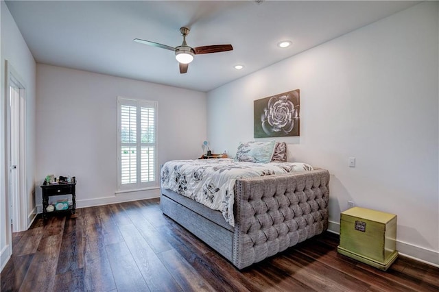 bedroom with ceiling fan and dark wood-type flooring