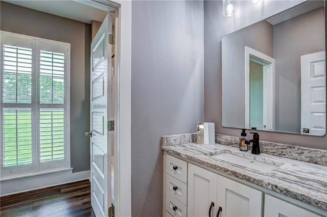 bathroom featuring vanity and wood-type flooring