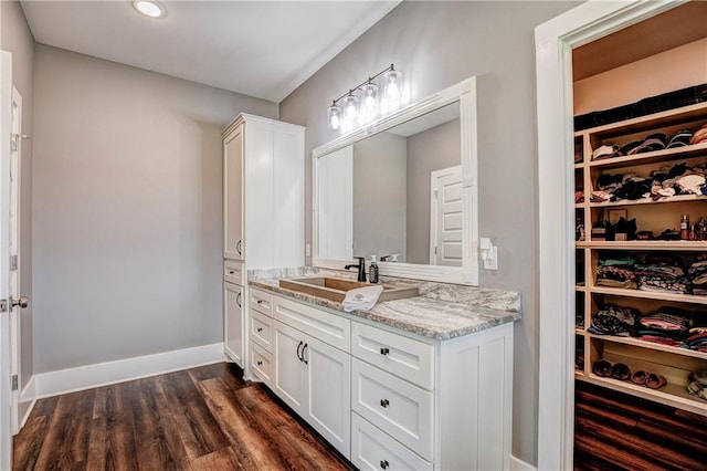 bathroom featuring hardwood / wood-style flooring and vanity