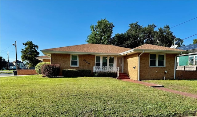 single story home featuring a front yard and a porch