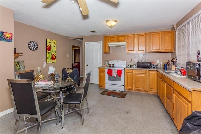 kitchen featuring white electric range oven, ceiling fan, and sink