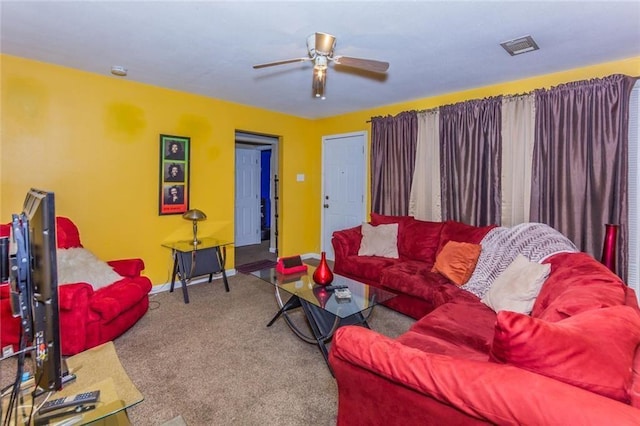 carpeted living room featuring ceiling fan