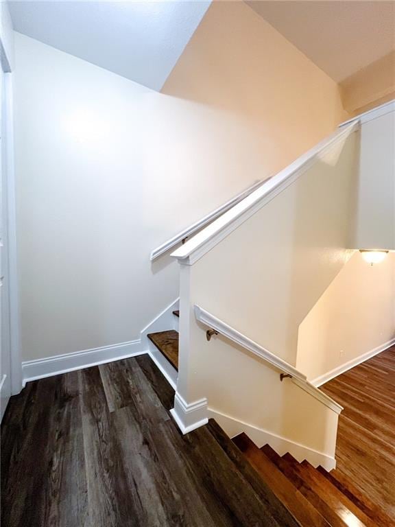 stairway featuring hardwood / wood-style floors