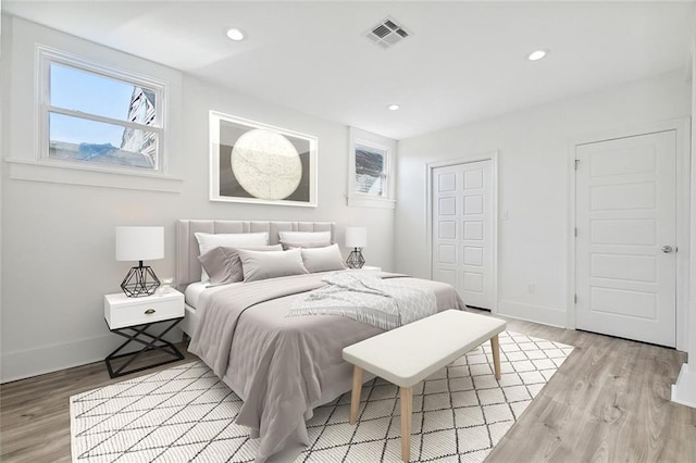 bedroom with wood-type flooring