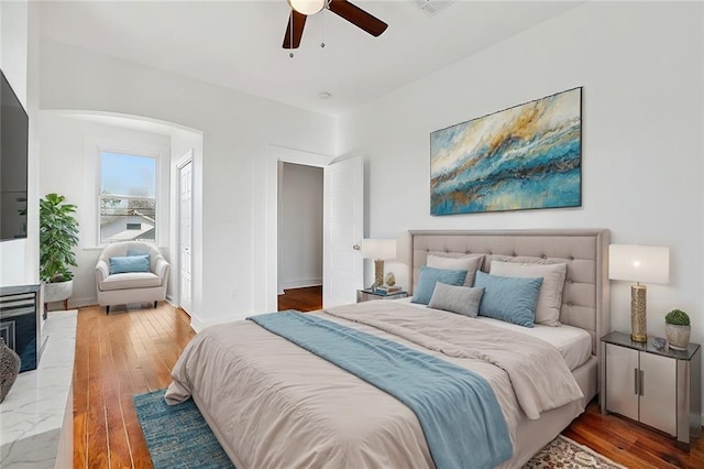 bedroom with hardwood / wood-style floors and ceiling fan