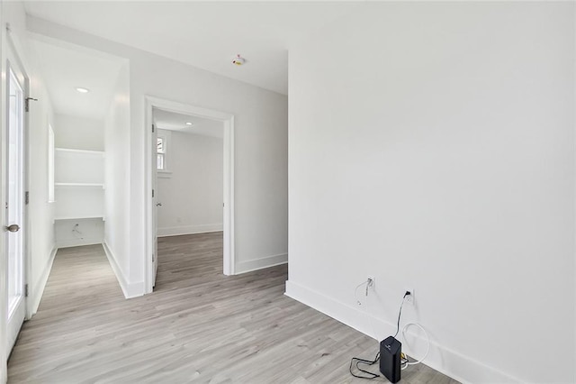 empty room with light hardwood / wood-style flooring