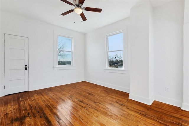 unfurnished room featuring hardwood / wood-style floors and ceiling fan