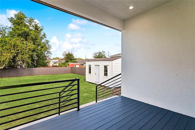 wooden terrace featuring a yard and french doors