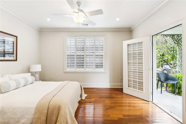 bedroom with ceiling fan, hardwood / wood-style flooring, access to exterior, and multiple windows