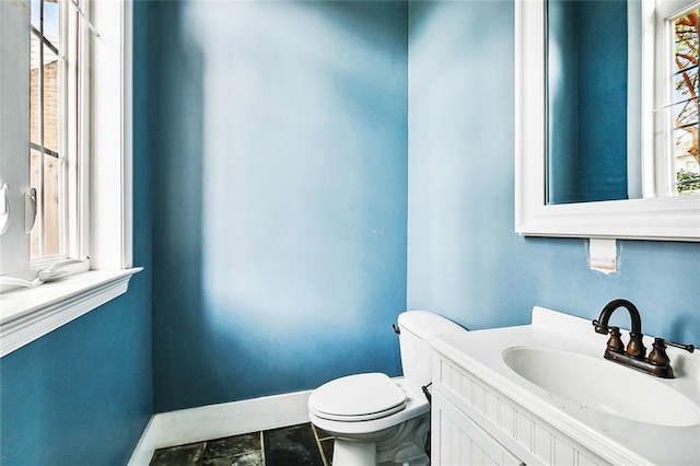 bathroom with toilet and vanity