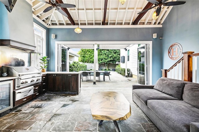 living room featuring high vaulted ceiling, beamed ceiling, beverage cooler, and plenty of natural light